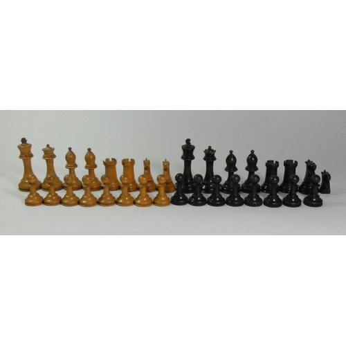 196 - A Nigerian thorn wood hand carved chess set, together with a ebonised boxwood chess set (2)