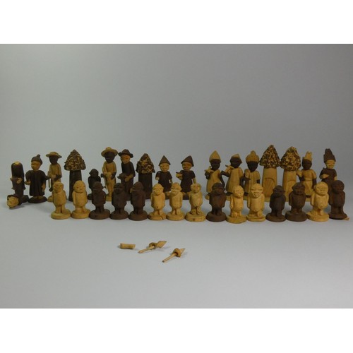 196 - A Nigerian thorn wood hand carved chess set, together with a ebonised boxwood chess set (2)