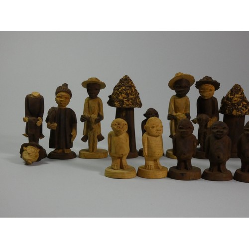 196 - A Nigerian thorn wood hand carved chess set, together with a ebonised boxwood chess set (2)