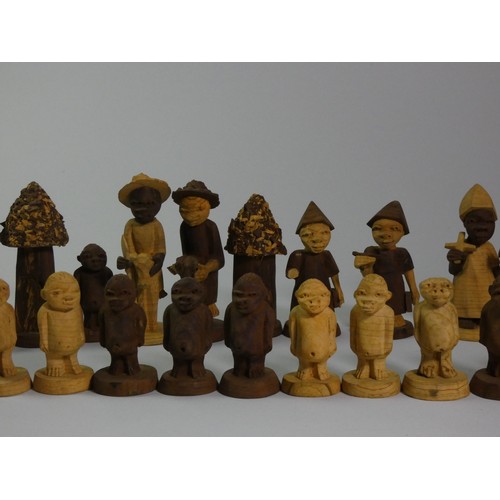 196 - A Nigerian thorn wood hand carved chess set, together with a ebonised boxwood chess set (2)