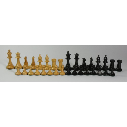 194 - A Chad Valley boxed wooden chess set,together with  a similar boxed chess set and a miniature chess ... 