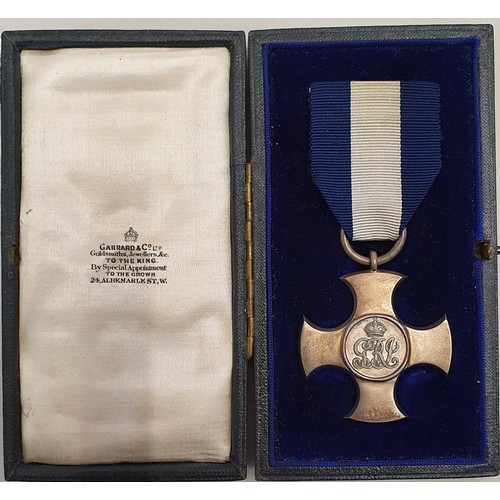 95 - A George V silver Distinguished Service Cross to Gnr George Gates R.N., cased, together with a quant... 