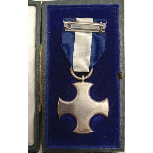 95 - A George V silver Distinguished Service Cross to Gnr George Gates R.N., cased, together with a quant... 