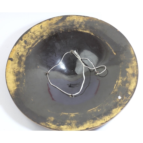 67 - A Japanese Jingasa (travelling hat) of circular form, finished in black lacquer with a gold lacquer ... 