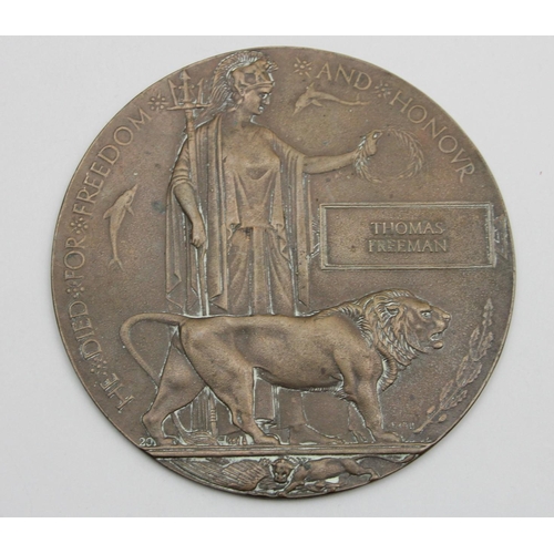 87 - WWI bronze memorial plaque or death penny for Thomas Freeman.