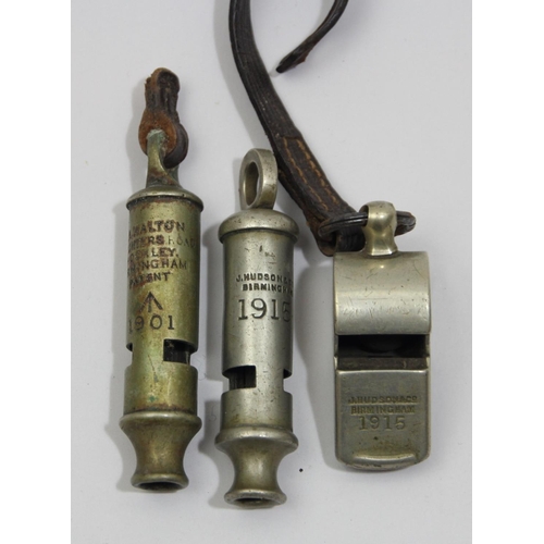 65 - A R.A. Walton military whistle, broad arrow and 1901, a J. Hudson example dated 1915 and another whi... 