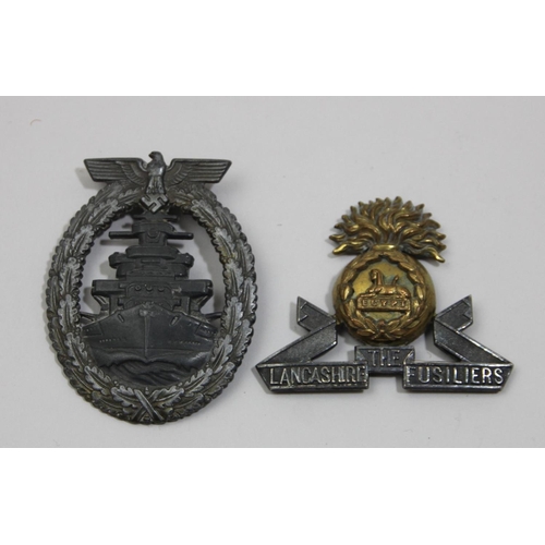 73 - A German WWII Kriegsmarine High Sea badge, by Friedrich Orth, together with a The Lancashire Fusilie... 