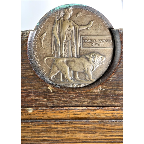 86 - A WWI Death penny, awarded to Harold Edward Hewitt, mounted in an oak and plaster shield, The Glorio... 