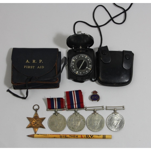 111 - Four WWII War medals 1939-1945, a 1939-1945 Star, and other items