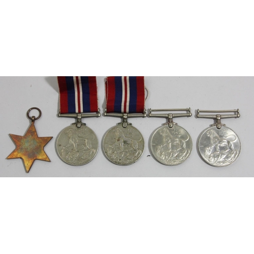 111 - Four WWII War medals 1939-1945, a 1939-1945 Star, and other items