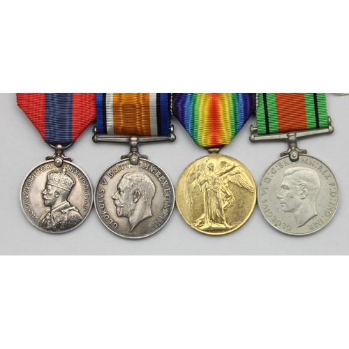 113 - A WWI/WWII group of four, awarded to Gnr W.G. Hammond, Royal Artillery, War 1914-18, Victory, Defenc... 