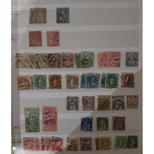 173 - A large collection of Swiss/Helvetia stamps, mainly used, and other loose stamps.