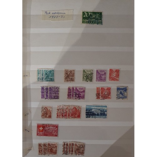 173 - A large collection of Swiss/Helvetia stamps, mainly used, and other loose stamps.