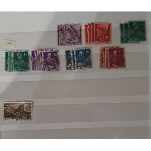 173 - A large collection of Swiss/Helvetia stamps, mainly used, and other loose stamps.