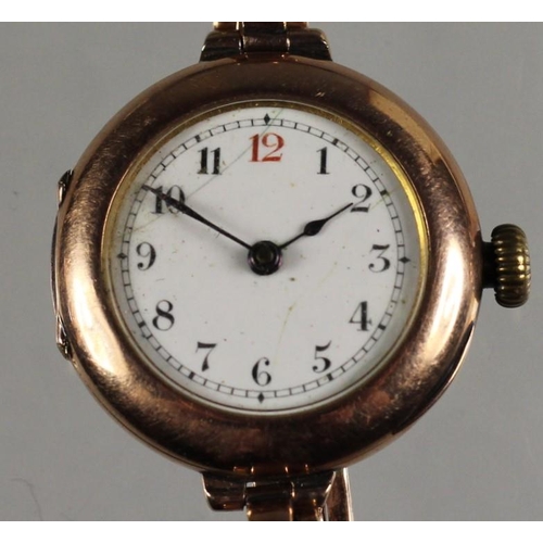 116 - A 9ct rose gold ladies manual wind wristwatch, London 1910, the white enamel dial with red 12, diame... 