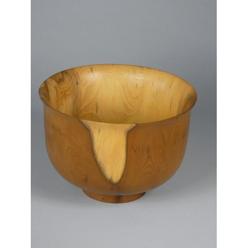 177 - Robin Wood, a collection of four turned yew wood bowls and a plate, each with carved sunrise motif t... 