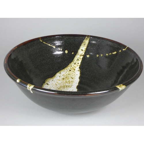 188 - Ron Green, a black glazed stoneware bowl with white detail, diameter 26 cm, together with a dark gre... 