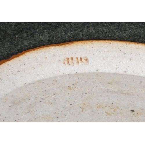 188 - Ron Green, a black glazed stoneware bowl with white detail, diameter 26 cm, together with a dark gre... 