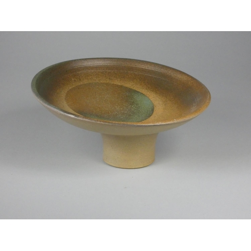 196 - Unknown, a collection of six stoneware display stands with green, brown, and yellow designs, diamete... 