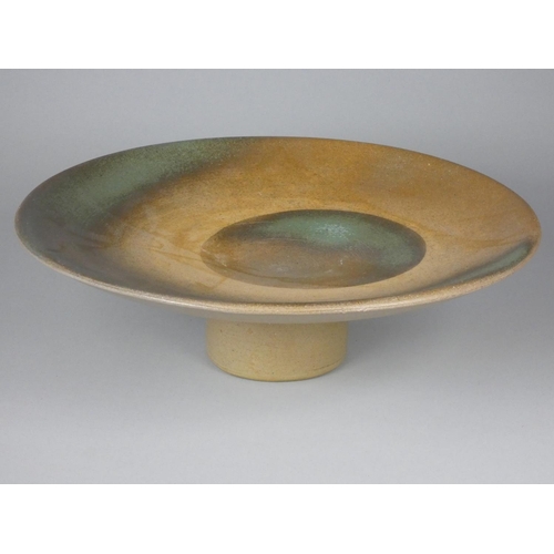 196 - Unknown, a collection of six stoneware display stands with green, brown, and yellow designs, diamete... 