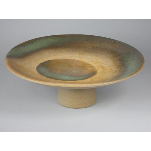 196 - Unknown, a collection of six stoneware display stands with green, brown, and yellow designs, diamete... 