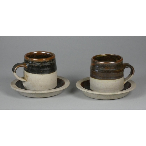 204 - A Colin Pearson teacup and saucer pair, stoneware with tenmoku glaze, height 7 cm