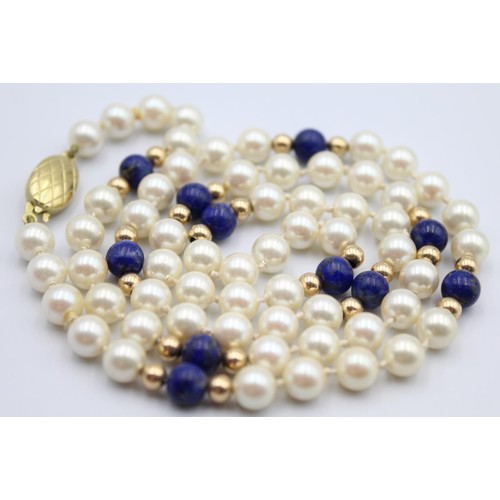 49 - A cultured pearl and lapis lazuli bead necklace, 9ct gold clasp, length 60 cm.