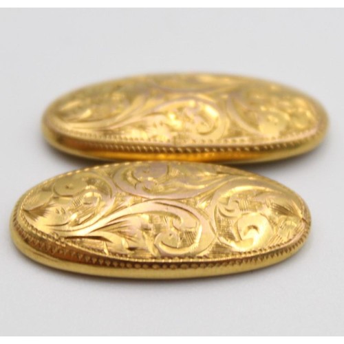 52 - A pair of oval 9ct rose gold cufflinks, Birmingham 1919, with engraved decoration, 3 gms.