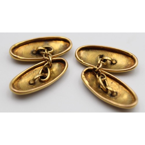 52 - A pair of oval 9ct rose gold cufflinks, Birmingham 1919, with engraved decoration, 3 gms.