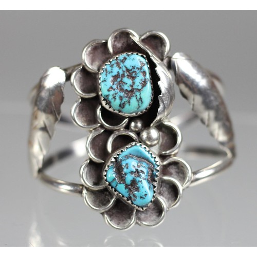76 - A Navaho silver and turquoise bangle, c.1980's, set with two matrix stones in a floral design, toget... 