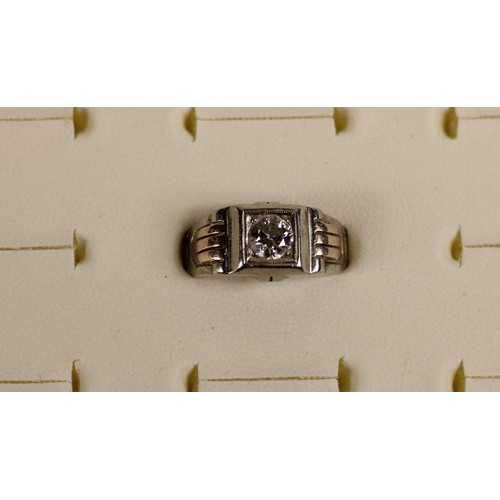 79 - An American 18k white gold and diamond ring, box set with an old cut brilliant cut stone weighing ap... 