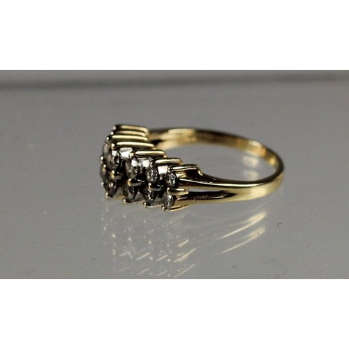 87 - A 14k diamond ring, claw set with two rows of brilliant cut stones, total weight approximately 1 ct,... 