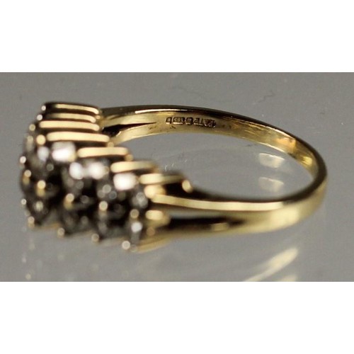 87 - A 14k diamond ring, claw set with two rows of brilliant cut stones, total weight approximately 1 ct,... 