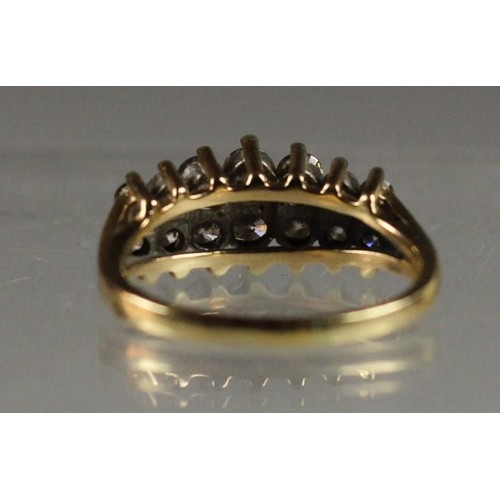 87 - A 14k diamond ring, claw set with two rows of brilliant cut stones, total weight approximately 1 ct,... 