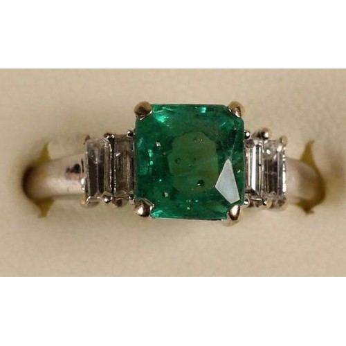 89 - An 18k white gold, emerald and diamond ring, claw set with a step cut stone, stated weight 1.75cts, ... 