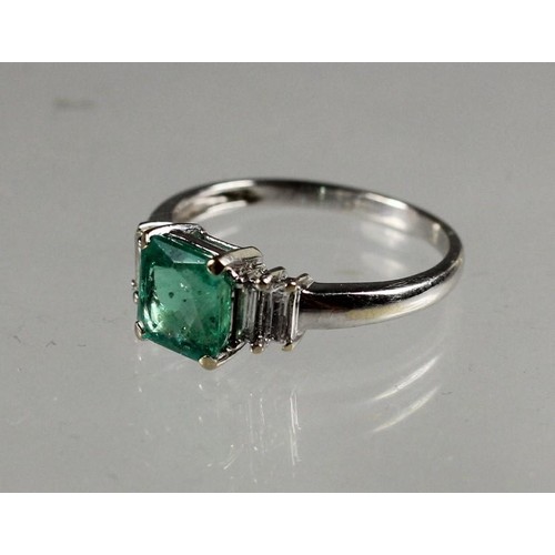 89 - An 18k white gold, emerald and diamond ring, claw set with a step cut stone, stated weight 1.75cts, ... 