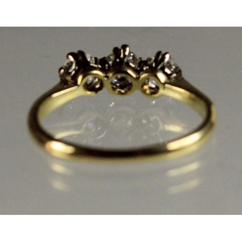 92 - An 18ct gold three stone diamond ring, claw set with old cut brilliant stones, total weight approxim... 