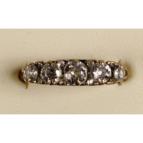 93 - A Victorian 18ct gold five stone diamond ring, carved claw set with graduated stones with points bet... 