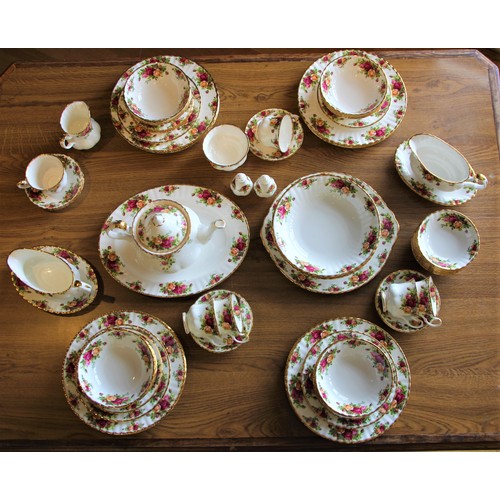 141 - A Royal Albert 'Country Roses' dinner service including, an oval platter (34x27 cm), serving plate (... 