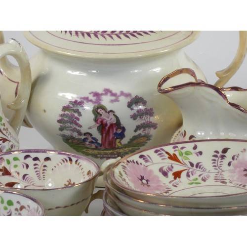 146 - A Sunderland lustre part tea service, comprising tea pot, 9 cups (2 lacking handles), 11 saucers, 2 ... 