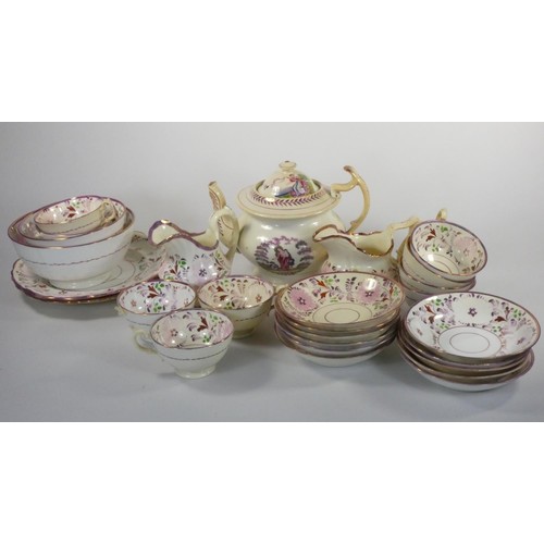 146 - A Sunderland lustre part tea service, comprising tea pot, 9 cups (2 lacking handles), 11 saucers, 2 ... 