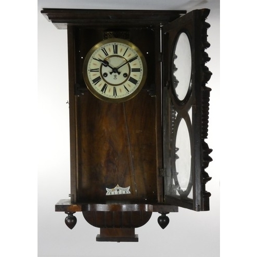 270 - Gustave Becker, a Vienna style walnut wall clock, with turned supports, pendulum, key, 90 cm.