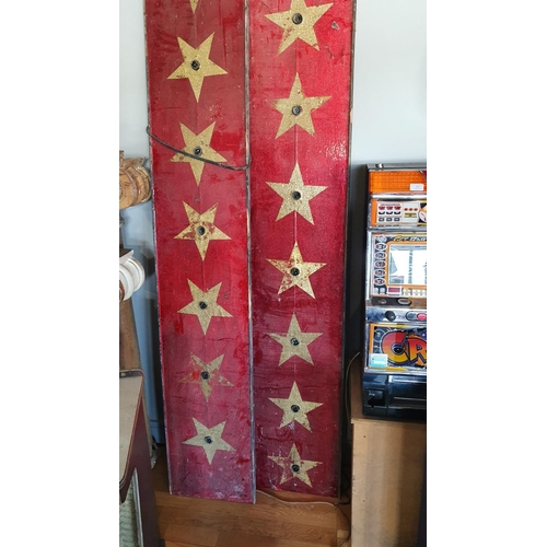 382 - A pair of red and gold star illuminated panels, 226cm and a W. Button & Co arcade game stand, c.1950... 