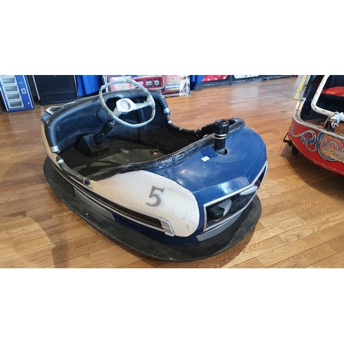 388 - A mid century fairground dodgem car, in original condition, later wooden base and wheels, 175 cm