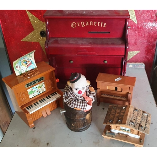 413 - Seven various musical boxes, to include a sad clown in a barrel