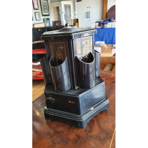 419 - A black plastic cigarette dispenser, by Selcol, England, the Reuge movement operating a rotating dis... 