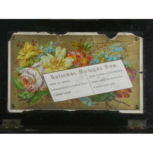 438 - A 19th century Swiss music box playing 6 airs the movement in need of restoration, numbered 31065.  ... 