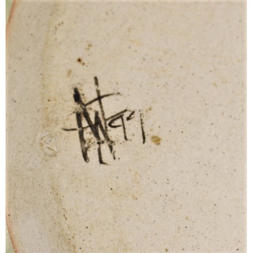 218 - A mid-20th century oval platter with abstract design, impressed mark signed and dated 1999, diameter... 