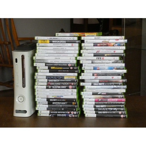 94 - An XBOX 360 console complete with games, controllers, headphones and cables.