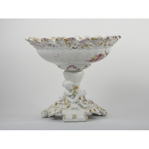 111 - A 19th century continental pedestal dish, the lift off cover with two cherubs and fruit, similar ped... 